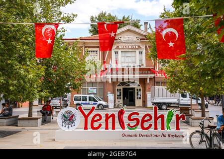 Yenisehir, Bursa, Turkey - August 14, 2021: Entrance facade of the town hall and the name monument of Yenisehir. Yenisehir is known as the first capit Stock Photo