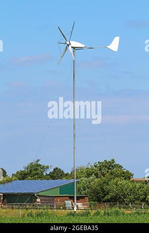 small wind turbine on german farm Stock Photo