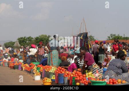 Tomato vendors are seen on the roadside in Dowa. Malawi. Stock Photo