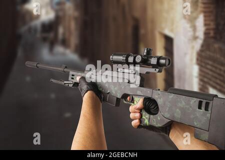 Children's toy sniper rifle made of wood in hands, closeup Stock Photo