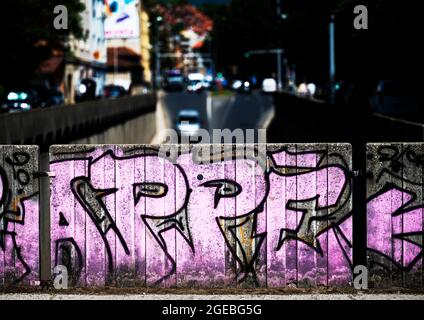 High contrast image of busy city streets with graffiti in the foreground, Zagreb, Croatia Stock Photo