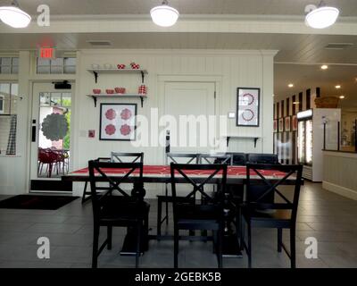 Interior of a restaurant with pattern design of white, black and red colors. Chairs and tables in a restaurant or a cafe Stock Photo