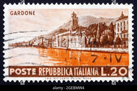 ITALY - CIRCA 1953: a stamp printed in the Italy shows Seaside at Gardone, circa 1953 Stock Photo