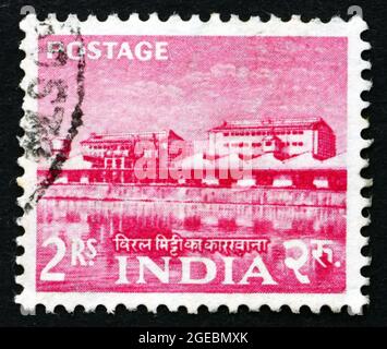 INDIA - CIRCA 1955: a stamp printed in India shows rare earth factory, circa 1955 Stock Photo