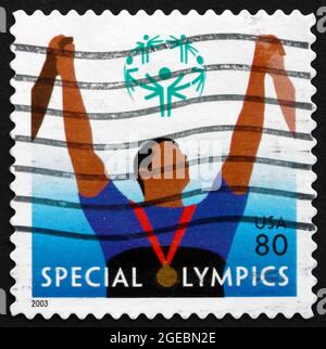 USA - CIRCA 2003: a stamp printed in the USA shows Athlete with Medal, Special Olympics, Sports Organization for Children and Adults with Intellectual Stock Photo