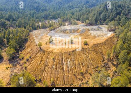 Mining stock piles at abandoned site of copper mine in Paphos forest, Cyprus. Aerial view