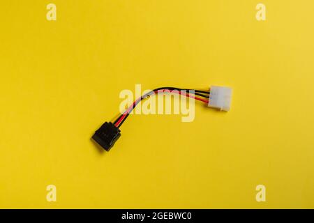 computer cord on a yellow background Stock Photo