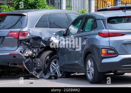 NEW ORLEANS, LA, USA - July 30, 2021: Car crashed into parked car on neighborhood street Stock Photo