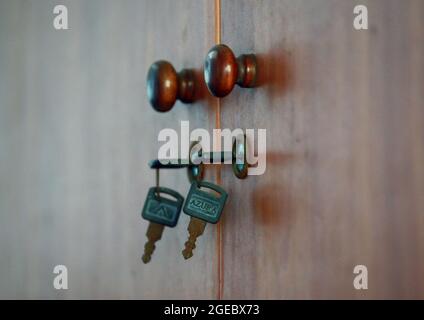 Jakarta, Indonesia-August 16, 2021: two keys hanging in the kitchen cabinet Stock Photo