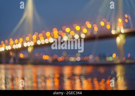 Abstract background with bokeh light of night bridge, car headlights, evening lights of big city Stock Photo