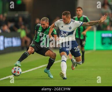 Austin, Texas, USA. August 18, 2021: Austin FC forward Diego Fagundez (14) battles Vancouver Whitecaps defender Jake Nerwinski (28) for possession during a Major League Soccer match between Austin FC and the Vancouver Whitecaps on August 18, 2021 in Austin, Texas. (Credit Image: © Scott Coleman/ZUMA Press Wire) Credit: ZUMA Press, Inc./Alamy Live News Stock Photo