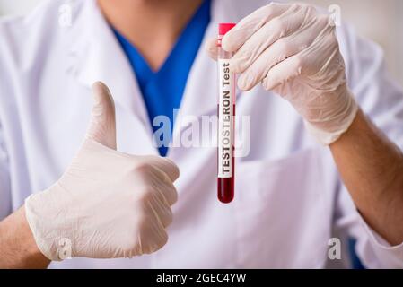 Young biochemist testing blood samples Stock Photo