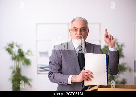 Old businessman employee in dismissal concept Stock Photo