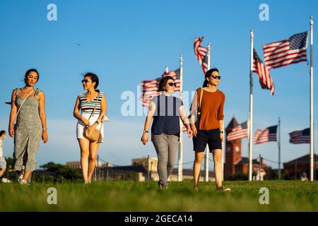 Washington, USA. 18th Aug, 2021. Tourists visit the National Mall in Washington, DC, the United States, on Aug. 18, 2021. The United States will begin administrating COVID-19 booster shots next month as new data shows that vaccine protection wanes over time, top U.S. health officials announced Wednesday. Credit: Liu Jie/Xinhua/Alamy Live News Stock Photo