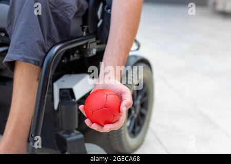 Disabled Boccia player playing on a wheelchair Stock Photo