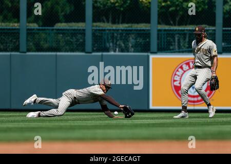 San Diego Padres center fielder Trent Grisham (2) dives for a ball during an MLB regular season game against the Colorado Rockies, Wednesday, August 1 Stock Photo