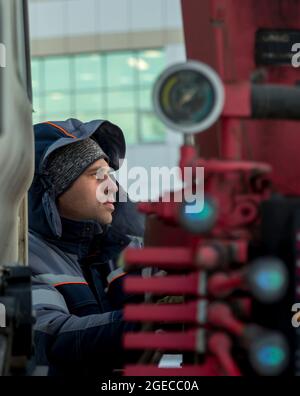 The driver of the hydraulic manipulator in the workplace Stock Photo