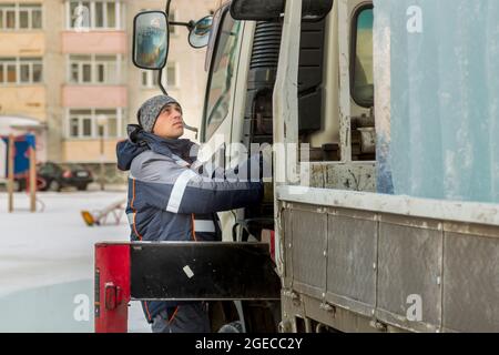 The driver of the hydraulic manipulator in the workplace Stock Photo