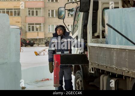 The driver of the hydraulic manipulator in the workplace Stock Photo