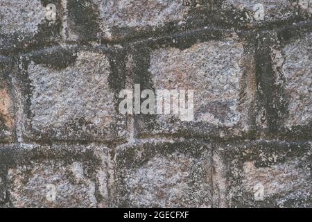 Old Temple wall. Rectangular cut out marble granite brick real surface stone with cement. Pattern gray color rustic texture background. Design website Stock Photo