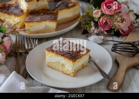 German quark cake or cheese cake called Eierschecke. Delicious and traditional sheet cake from Germany. Served on on table Stock Photo