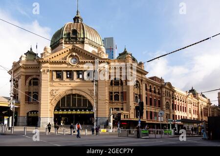 Melbourne, Australia, 4 August, 2020. A view of Flinders Street Station as seen from the adjacent corner of Flinders and Swanston Streets during COVID-19 in Melbourne, Australia. In just 24 hours, Melbourne will fall into the imposition of the full effect of Daniel Andrews Stage 4 COVID-19 restrictions. Retailers, services, construction and many more will trade for the last time tomorrow before being forced to close for at least the next 6 weeks with many unlikely to ever reopen again. This comes as 439 new cases were uncovered overnight along with 13 deaths all of which were patients at aged