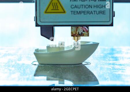Close up of the process of printing 3d printed sailing boat. Stock Photo