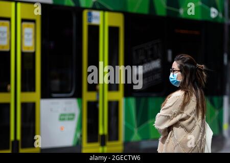 Melbourne, Australia, 9 September, 2020. A woman wearing a facemask is seen waiting for a tram during COVID-19 in Melbourne, Australia. Victoria records a further 76 cases of Coronavirus over the past 24 hours, an increase from yesterday along with 11 deaths. This comes amid news that AstraZeneca pauses vaccine study. Credit: Dave Hewison/Speed Media/Alamy Live News Stock Photo
