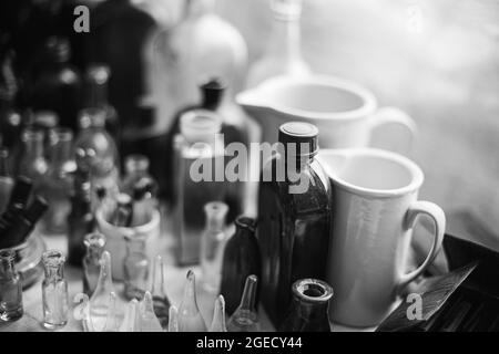 Many Old Deutsch Vintage Medical Glass Capacity. Detail Of Retro Chemical Pharmaceutical Science Researches. Small Bottles Different Sizes From Times Stock Photo