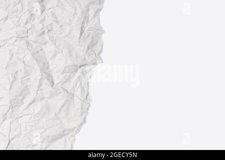 Torn Gray Crumpled paper on white cardboard texture. Blank Paper background with Copy space for text and graphics Stock Photo