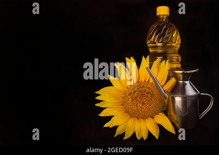 Sunflower and sunflower oil still life isolated on black background Stock Photo