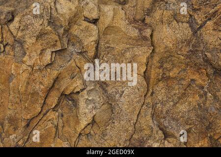 Sandstone texture with uneven fractures, close-up, high resolution. Macrophoto. Stock Photo