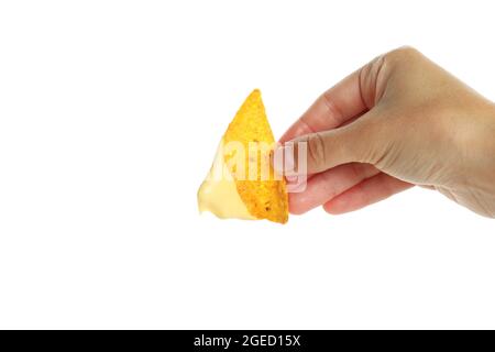 Female hand holds chip with cheese sauce, isolated on white background Stock Photo