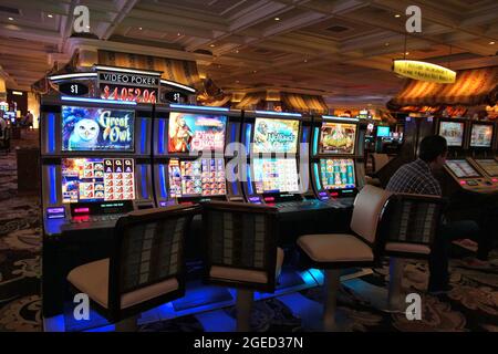 LAS VEGAS, USA - APRIL 14, 2014: People visit Bellagio resort in Las Vegas.  The famous casino resort has almost 4,000 rooms Stock Photo - Alamy