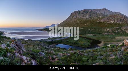 View of the Kogelberg Mountains  and the Rooi-Els Estuary along Clarence Drive between Gordon's Bay and Rooi-Els. False Bay. Western Cape. South Afric Stock Photo