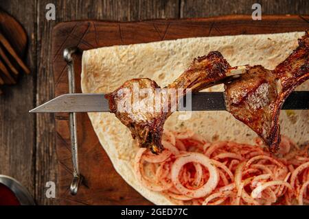 Grilled georgian lamb ribs shashlik skewers Stock Photo