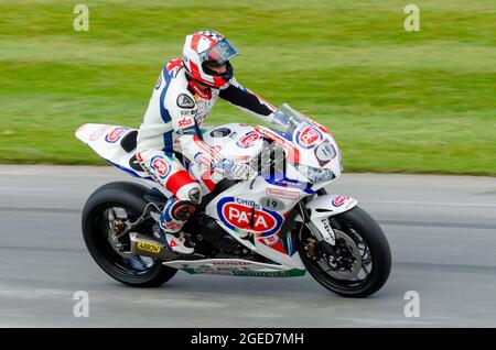 Honda CBR1000RR Fireblade motorcycle racing up the hill climb track at the Goodwood Festival of Speed motor racing event 2014. Stock Photo