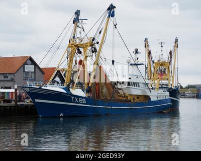 Fishing boat TX68 in the port of Oudeschild on Texel island, the Netherlands. The fishermen leave on sunday evening and return to port on friday after Stock Photo