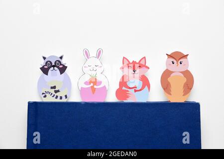 Cute bookmarks with book on white background Stock Photo