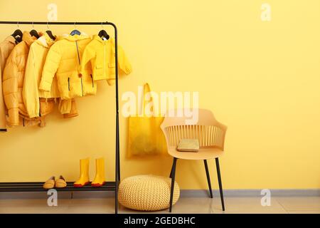 Interior of hallway with stylish clothes Stock Photo