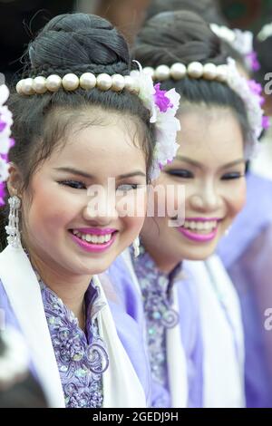 Samutprakan, Thailand - APRIL 30, 2012: Mon teenage girls in traditional dress having fun together during celebrating Mon new year, Songkran Festival. Stock Photo