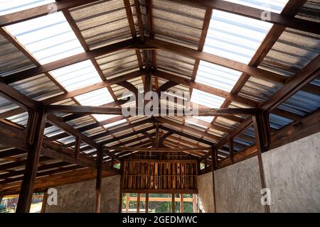 Under the translucent wooden roof structure on construction site