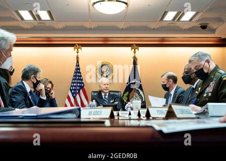 Washington, United States Of America. 18th Aug, 2021. U.S. President Joe Biden meets on the situation in Afghanistan with his National Security team in the Situation Room of the White House August 18, 2021 in Washington, DC. Sitting from left to right are: Secretary of State Tony Blinken, Vice President Kamala Harris, President Joe Biden, National Security Advisor Jake Sullivan, Secretary of Defense Lloyd Austin and Chairman of the Joint Chiefs Gen. Mark Milley. Credit: Planetpix/Alamy Live News Stock Photo