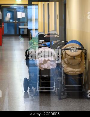Doberlug Kirchhain, Germany. 19th Aug, 2021. Prams stand in the corridor in a residential building of the initial reception facility for refugees and asylum seekers, which is run by the DRK Refugee Aid. According to the Central Foreigners Authority of Brandenburg, the arrival of the first local forces from Afghanistan is expected here during the night. In the multi-storey house, rooms are prepared for the arrival on an upper floor. Credit: Soeren Stache/dpa-Zentralbild/dpa/Alamy Live News