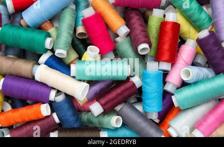 Multicolored sewing threads. Colourful thread spools. Stock Photo