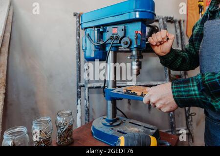 Senior carpenter working in his room Stock Photo