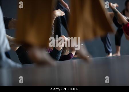 several dancers move on floor n contact improvisation performance intentionally with motion blur ond defocus bokeh Stock Photo