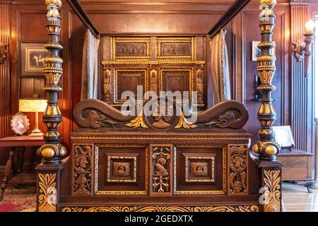 Colonial bed in Casa Loma. Casa Loma is a Gothic Revival architecture castle which is a major tourist attraction in the city of Toronto, Canada Stock Photo