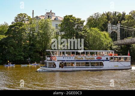 Chester, Cheshire, England - July 2021: Tour boat taking visitors on a sightseeing trip on the River Dee, which runs through the city Stock Photo