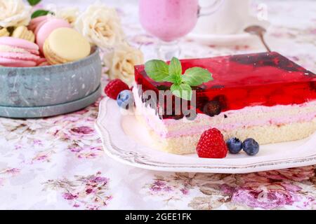 Layer fruit cake decorated with lemon balm leaf. Party time Stock Photo
